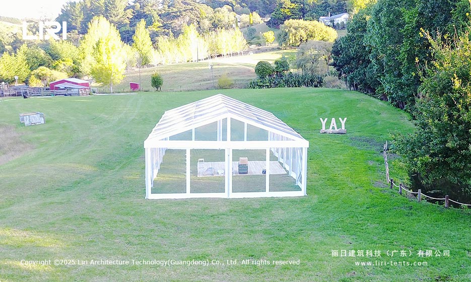 Aerial front view of a clear top lawn event tent